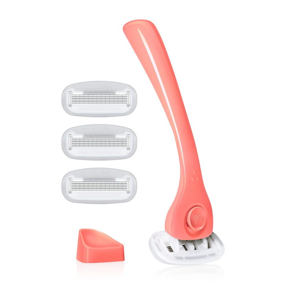 Billie razor front view in coral showing ergonomic shape and smooth shave benefit
