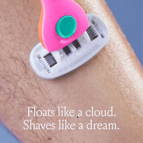 Billie razor next to coin showing scale and compact size for travel convenience