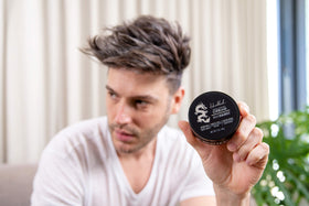 Billy Jealousy styled short haircut side view illustrating strong hold and definition
