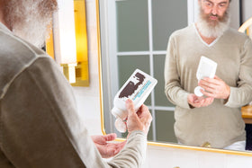 Billy Jealousy placed on bathroom shelf in lifestyle scene showing daily-use appeal