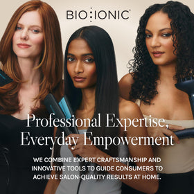 Bio Ionic curling iron held in hand for scale showing extended reach and control