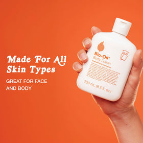 Bio-Oil bottle in hand for scale to show 5.9 oz size and travel-friendly compactness