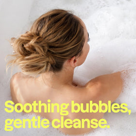 BIO SPECTRA ATTITUDE pouring bubble bath into tub demonstrating gentle foam