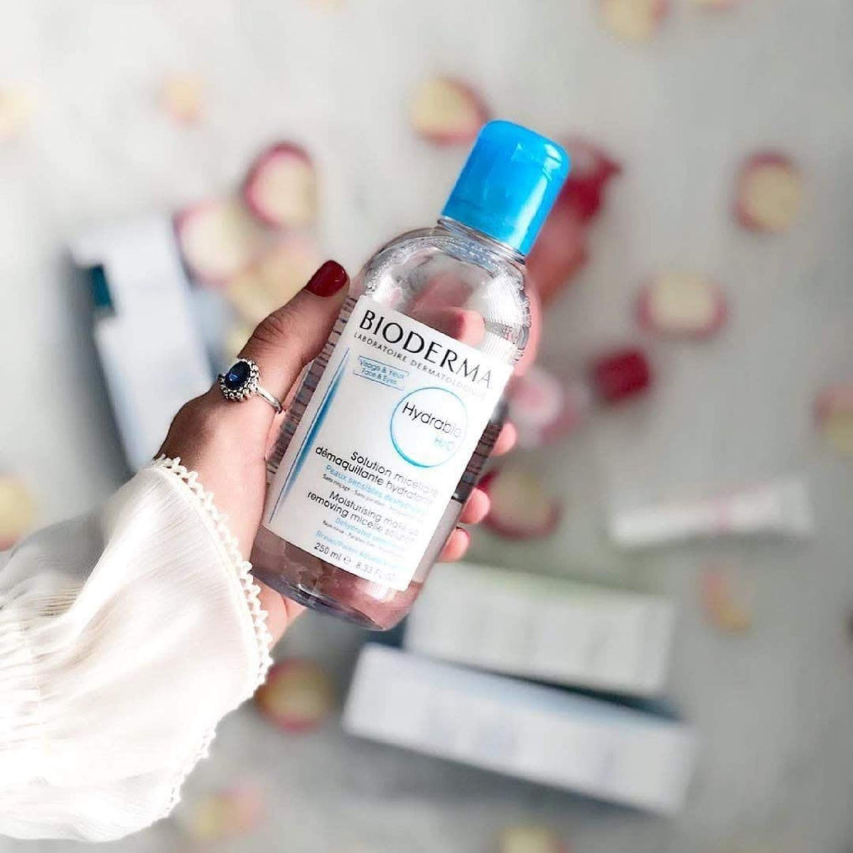 Small travel bottle refilled from Bioderma to show portability and cost-saving benefit