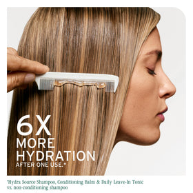 Biolage being applied to wet hair in shower for easier comb-through benefit