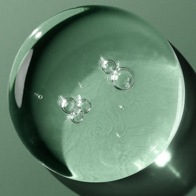 Biolage can held in hand showing 10 fl oz size and portability