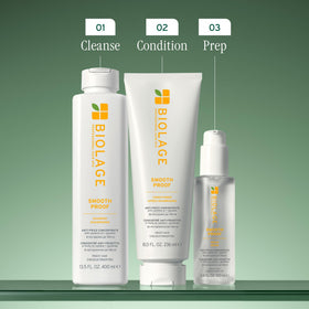 Biolage bottle beside camellia flowers and glycerin to show key ingredients benefit