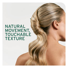 Biolage spray in use by stylist providing quick-dry finish