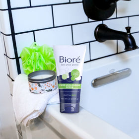 Bioré scrub foaming on skin showing in-use cleansing and softer-skin benefit
