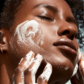 BIOSSANCE product beside aloe leaves highlighting soothing hydration