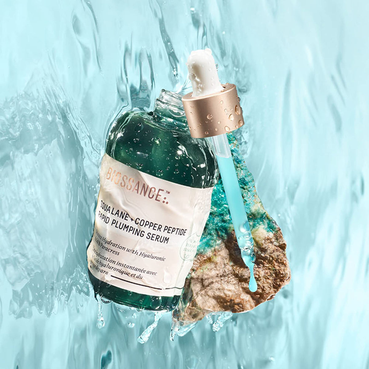 Biossance dropper dispensing serum demonstrating lightweight absorbent action