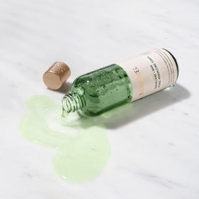 BIOSSANCE toner soaked on cotton pad showing gentle exfoliation benefit