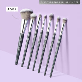 BK BEAUTY brush beside coin showing compact size and travel-friendly portability
