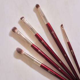 BK BEAUTY brushes next to ruler and pouch showing compact travel-ready size
