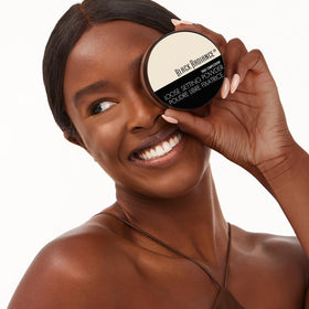 Black Radiance powder swatch next to foundation showing shade match accuracy