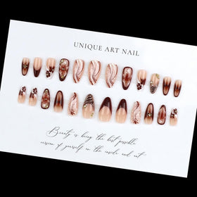 BLGTGH nails worn on hand in lifestyle scene enhancing fall outfit