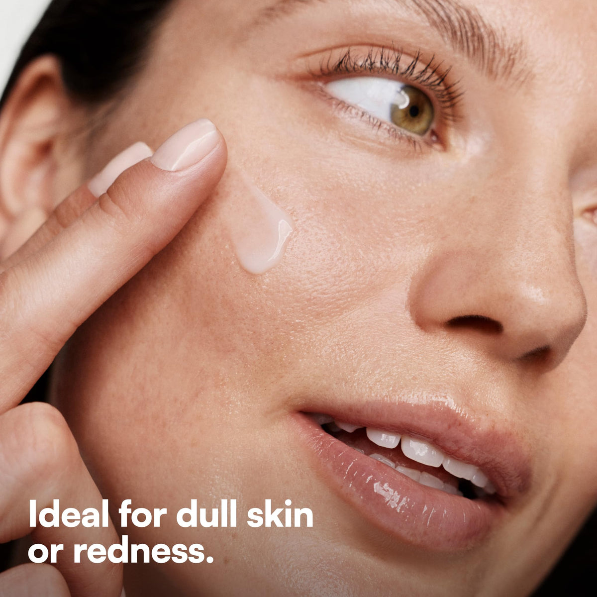 Bliss hand applying serum to cheek demonstrating easy application benefit