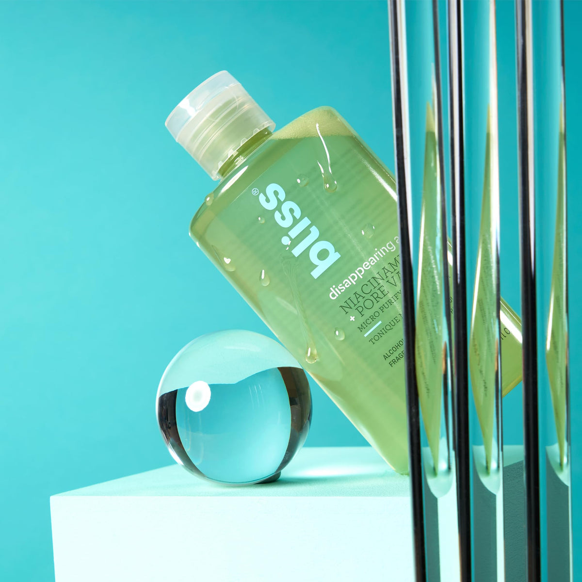 Bliss beside ruler showing 10 fl oz size and travel-friendly volume benefit