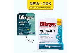 Person applying Blistex to lips outdoors, soothing and protective