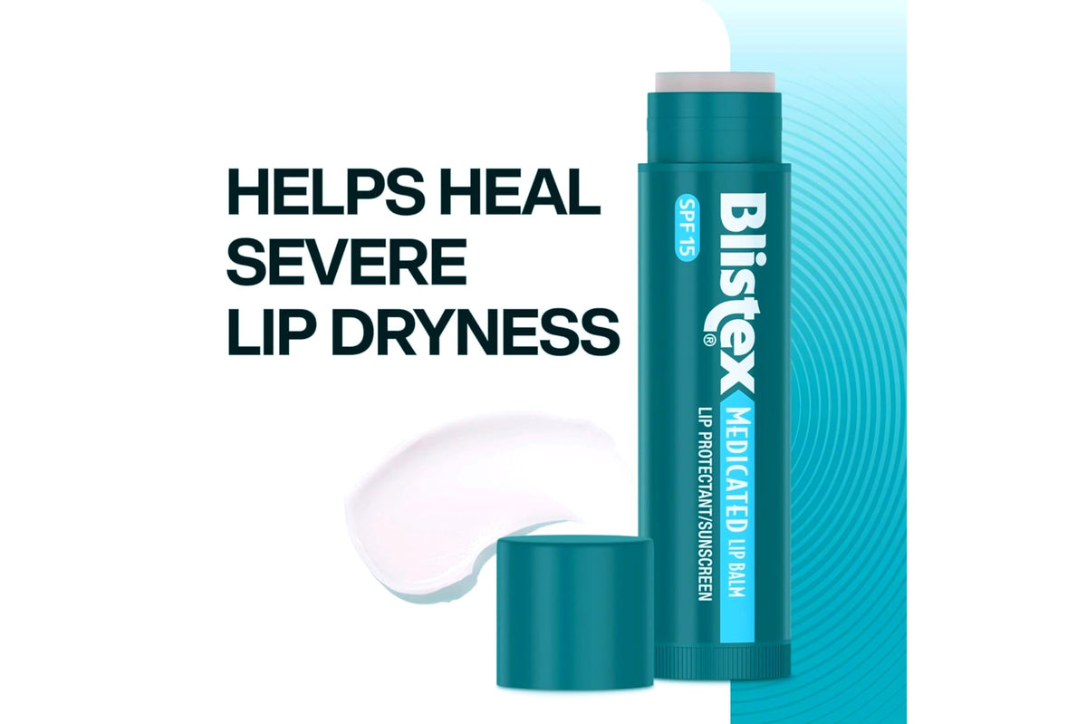 Blistex tube held next to a coin for size comparison and portability