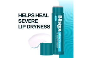 Blistex tube held next to a coin for size comparison and portability