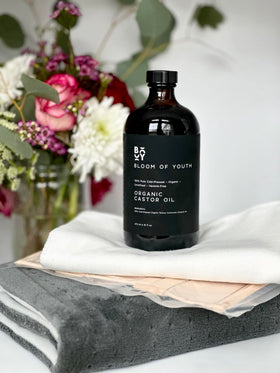 Bloom of Youth 16oz bottle beside common objects to show true size