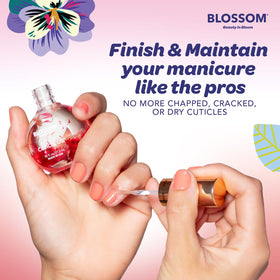 Blossom strawberry being massaged into cuticle for softer, smoother nails
