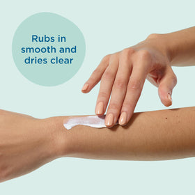 Applying Blue Lizard sunscreen to forearm showing even coverage and protection