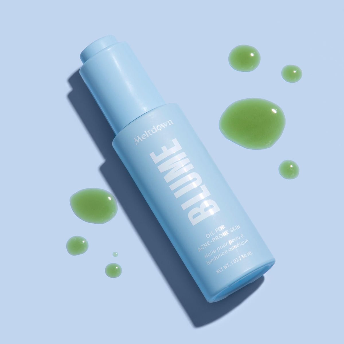 Blume Meltdown drop on fingertip ready for spot treatment to reduce redness