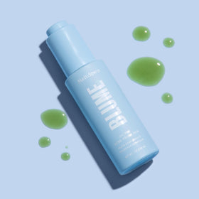 Blume Meltdown drop on fingertip ready for spot treatment to reduce redness