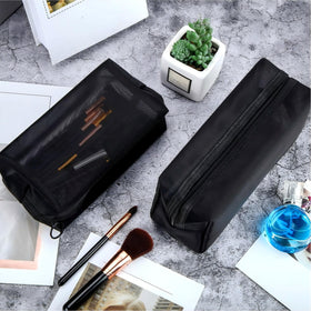 Boao pouches compared to a hand showing compact size and portability