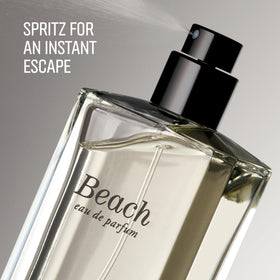 Bobbi Brown bottle on sand with ocean background suggesting fresh beach atmosphere
