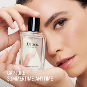 Bobbi Brown bottle next to everyday items showing 1.7 fl oz travel-friendly size