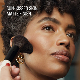 Bobbi Brown bronzer being applied with brush for natural contour