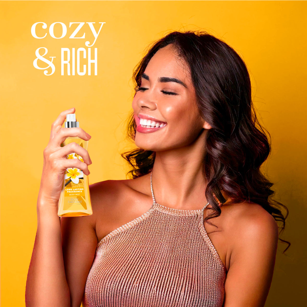 Body Fantasies bottle in a hand showing size and travel-friendly convenience