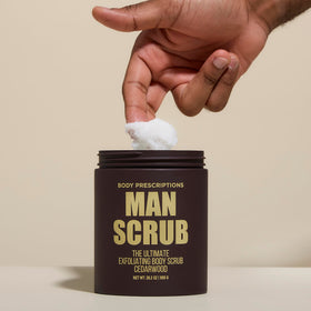 Body Prescriptions scrub texture closeup showing exfoliant grit and smoothing benefit
