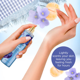 Model spraying Bodycology Blue Denim mist for quick refresh and subtle all-over fragrance