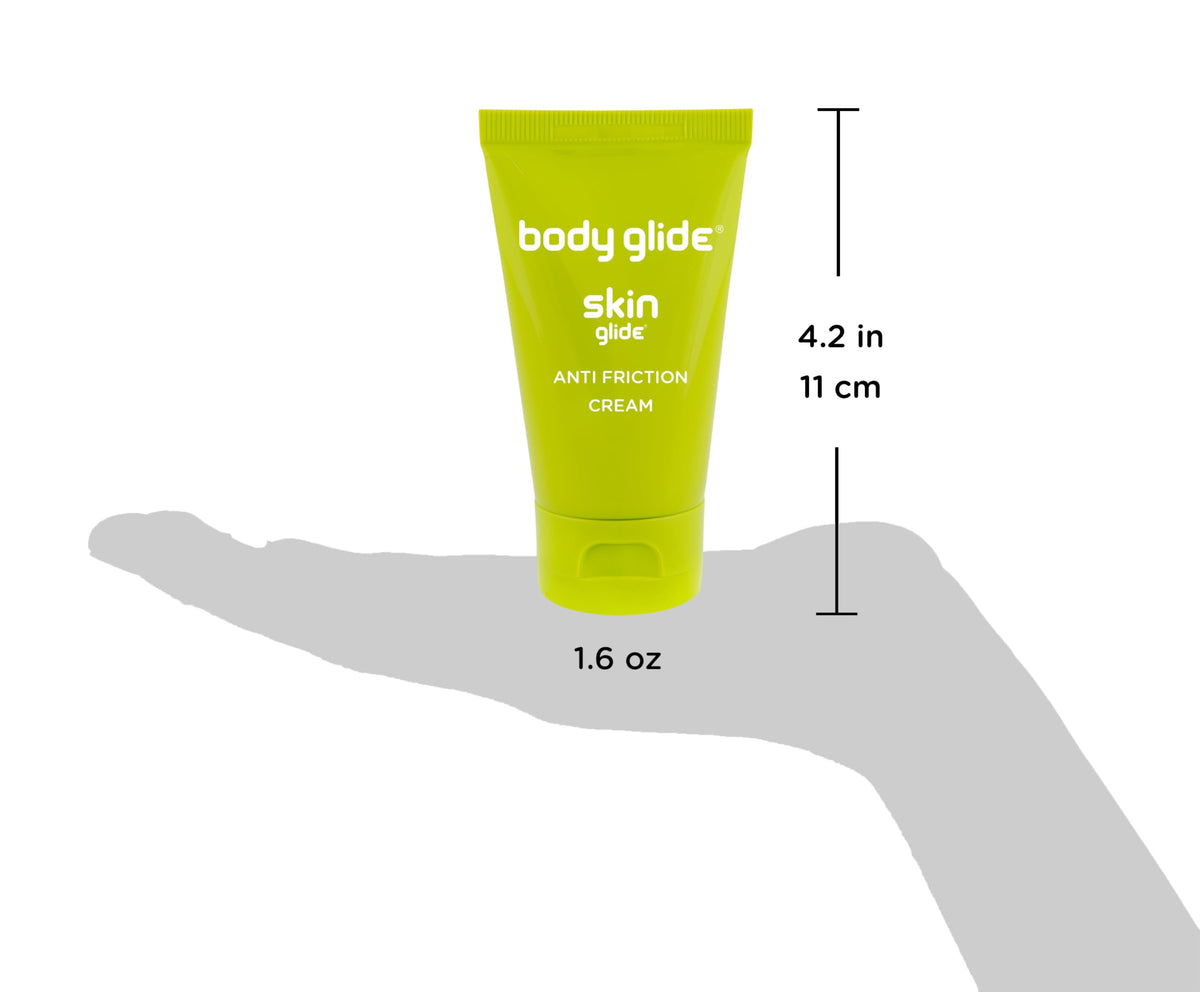 Person applying BodyGlide to inner thigh during workout, prevents rubbing discomfort