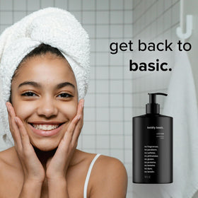 Boldly Basic applying lotion to hand demonstrating non-greasy finish