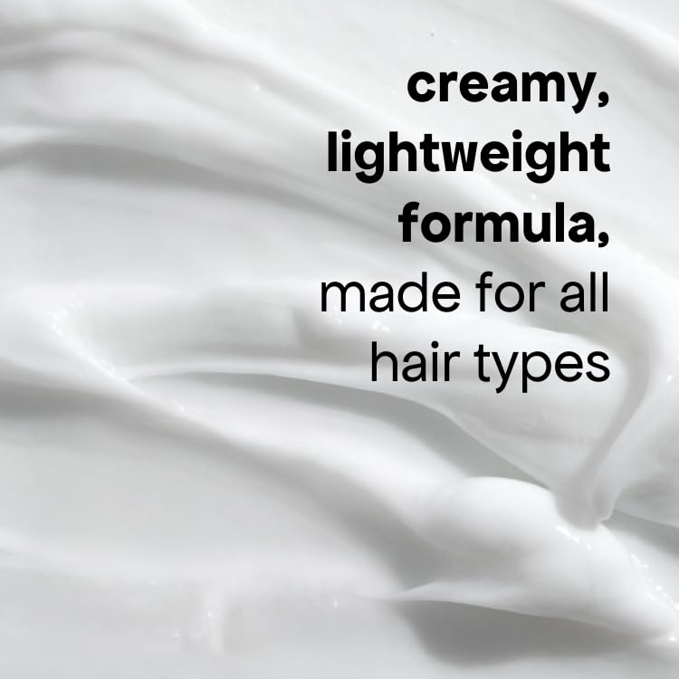 BONDIBOOST applying conditioner in shower to mid-lengths for manageability benefit