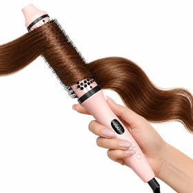 Bopcal brush front view showing sleek soft-pink finish and ergonomic handle for easy grip
