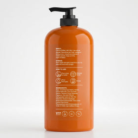Botanic Hearth bottle next to hand for size and 16 fl oz scale