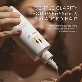 Bounce Curl texture foam on hand showing gentle lather and rinse benefit