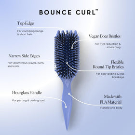 Bounce Curl brush held in hand to show scale and ergonomic grip for comfortable styling