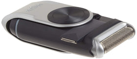 Braun M90 under running tap illustrating washable head for easy cleaning