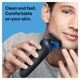 Braun body groomer held in hand demonstrating safe body hair trimming