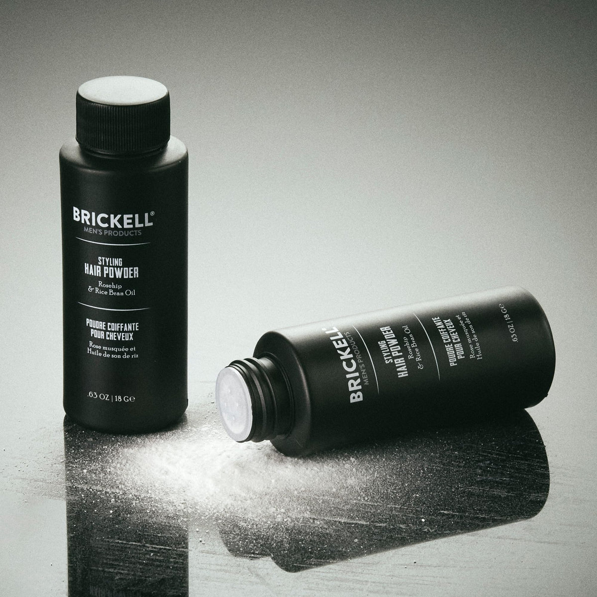 Brickell applying powder at roots with fingers to create instant lift and volume