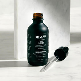 Brickell argan oil on a hand demonstrating small-dose application benefit