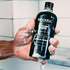 Brickell conditioner cream poured showing rich texture that hydrates and soothes scalp