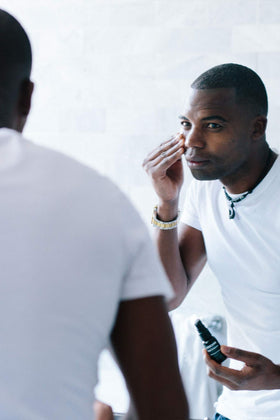 Brickell Men's Products shown in hand to demonstrate product size and travel convenience